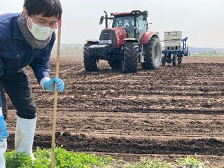 棒をたてる普及員